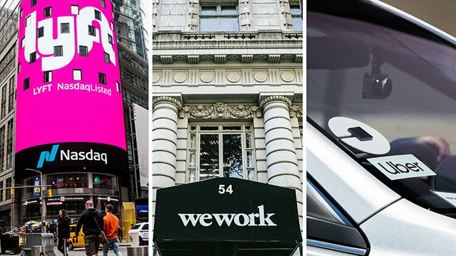 Logo Lyft, WeWork v&agrave; Uber tr&ecirc;n đường phố Mỹ. Ảnh:&nbsp;NYT